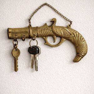 Antique Brass Peacock & Duck Design Pistol-Shaped Wall Key Holder With Chain